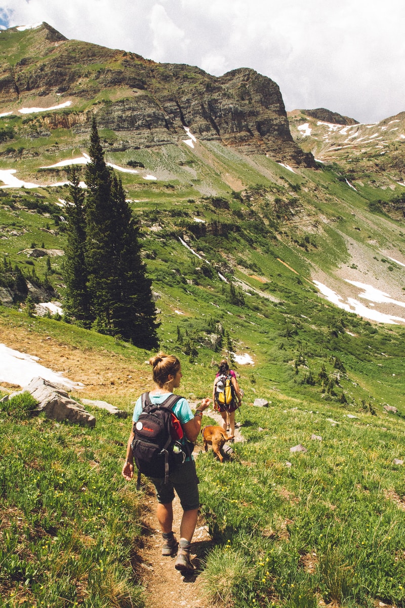 woman walking down the hill at daytime